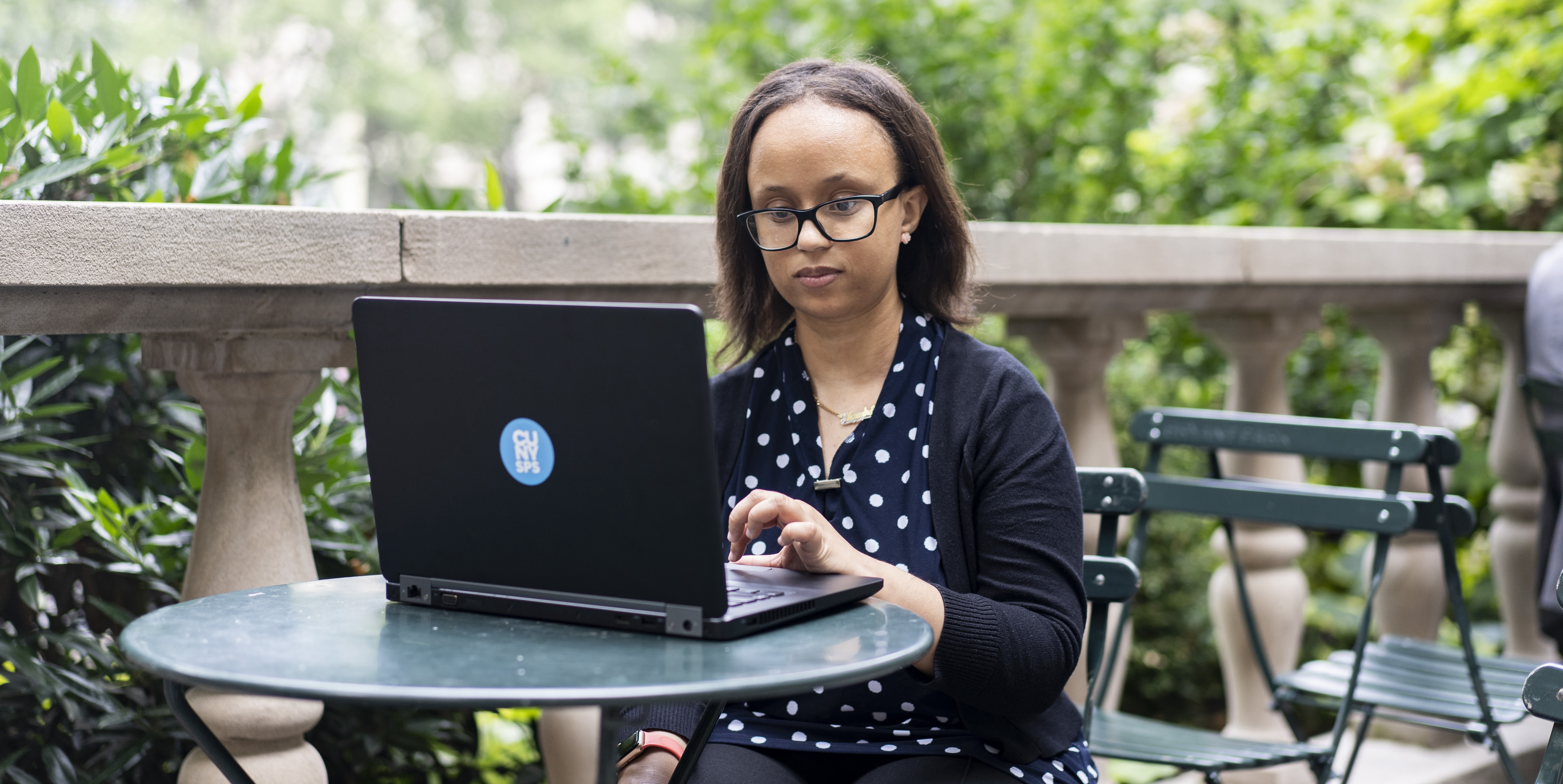 Female student coding on laptop
