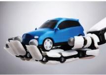 Image of robotic arm holding a car that was used to illustrate Dr. Arthur O'Connor's article 
