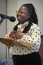 CUNY SPS HR Benefits Manager Kimesha Johnson welcomes guests and acknowledges the service awardees