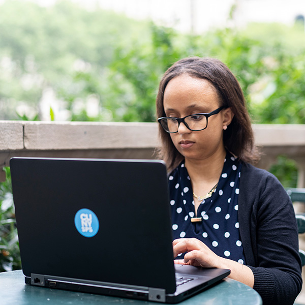 CUNY SPS online adult student working on a project for class