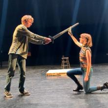 Miles the Doppelganger, played by Hayden Palmer, fights Agnes, played by Claire Schnatterbeck, in a Sheridan High School Drama Club rehearsal of “She Kills Monsters.” (Grace Cannon)